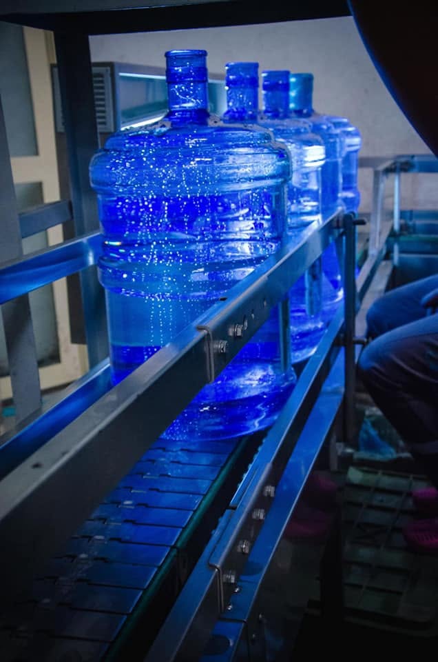Bottles moving along the conveyor production line